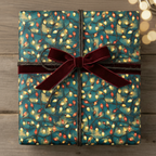 Teal Christmas gift wrap with string lights pattern, tied with velvet burgundy ribbon, rustic and elegant.