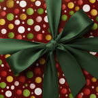 Festive Christmas gift wrap with red, green, and gold dot pattern and green satin bow.