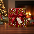 Christmas gift wrapped in colorful polka dot wrapping paper with a red satin ribbon and "Holiday Cheer" tag.