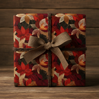 Elegant gift wrapped in red floral wrapping paper with a burlap bow and rustic twine.