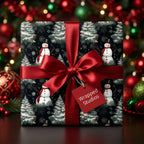 Snowman Christmas wrapping paper on a gift box with a red satin bow and Wrapped Studios tag.