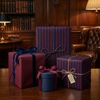 Elegant gifts wrapped in striped luxury wrapping paper, with velvet ribbons and twine, set in a library.