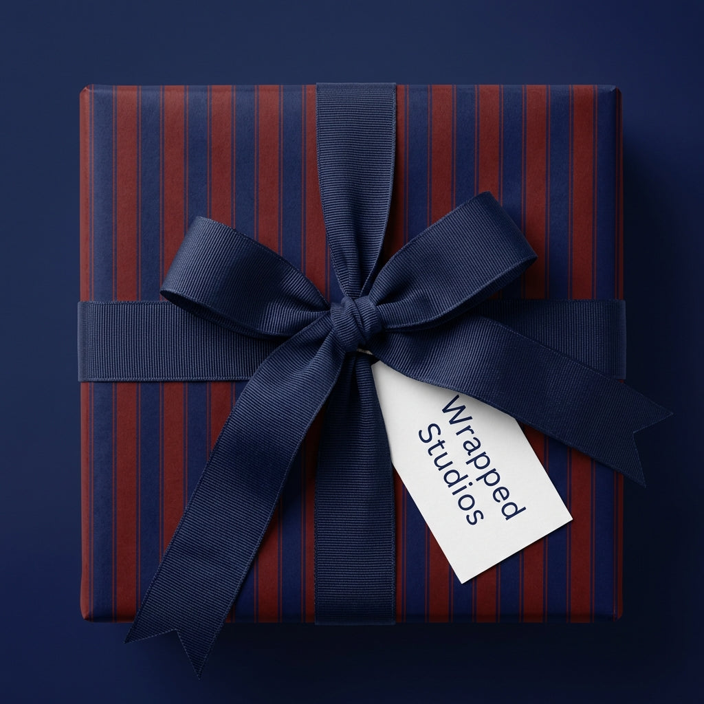 Navy blue striped gift wrap with bow and tag, elegant birthday wrapping paper.