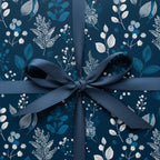 Elegant navy blue floral wrapping paper with matching ribbon for sophisticated gift presentation.
