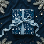 Navy blue floral wrapping paper with light blue ribbon for Christmas or winter birthday gift.