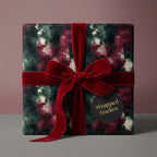 Elegant gift box with abstract floral wrapping paper and rich red velvet ribbon, Wrapped Studios.