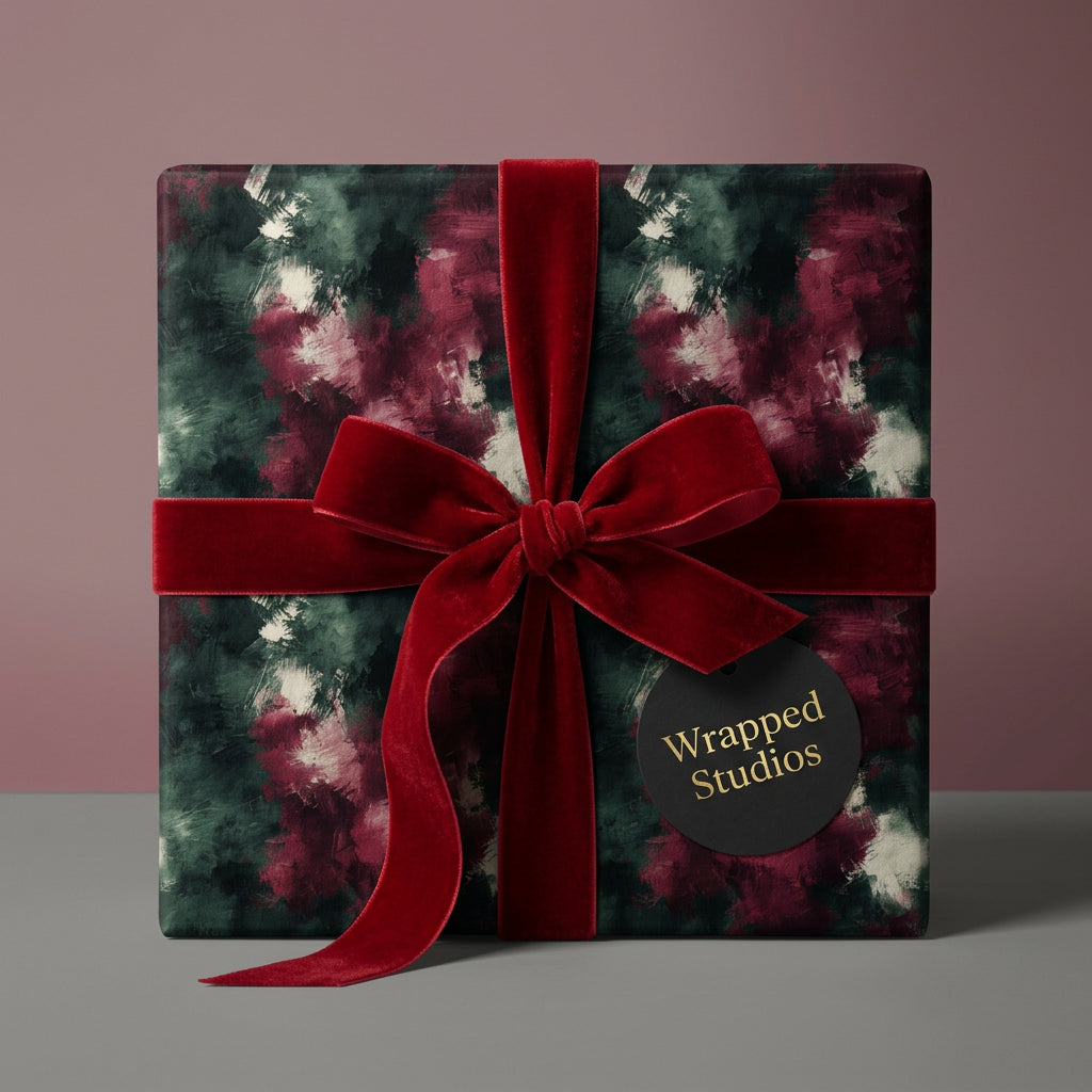 Elegant gift box with abstract floral wrapping paper and rich red velvet ribbon, Wrapped Studios.