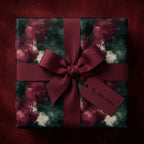Elegant "To: My Love" gift wrapped in painterly floral wrapping paper with deep red ribbon bow.