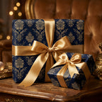 Elegant gifts wrapped in navy floral wrapping paper with gold ribbon, perfect for Christmas or a luxury birthday.