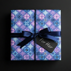 Square gift in blue floral wrapping paper with navy ribbon and "For Her" tag.