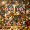Starry celestial Christmas wrapping paper with a luxury gold bow by Wrapped Studios.