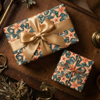Celestial star wrapping paper with a gold satin bow on holiday gifts by Wrapped Studios.