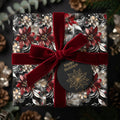 Elegant Christmas gift wrapped in floral paper with red velvet ribbon and "Happy Holidays" tag.