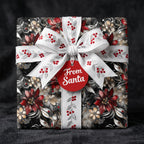 Elegant Christmas gift wrapped in floral wrapping paper with a white embroidered ribbon and "From Santa" tag.