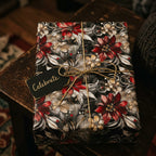 Elegant floral wrapping paper in red and gold for a celebration from Wrapped Studios.