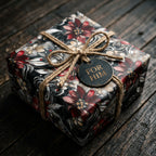 Elegant floral wrapping paper on a present for him, tied with rustic twine ribbon.