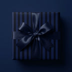Navy striped luxury gift wrap on square present with satin bow.