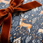 Elegant deer print wrapping paper with velvet ribbon bow, Wrapped Studios.