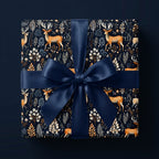 Elegant Christmas gift wrap with deer and floral pattern, finished with a navy satin bow.