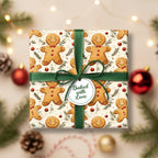 Gingerbread man Christmas gift wrap with green ribbon and "Baked with Love" tag.