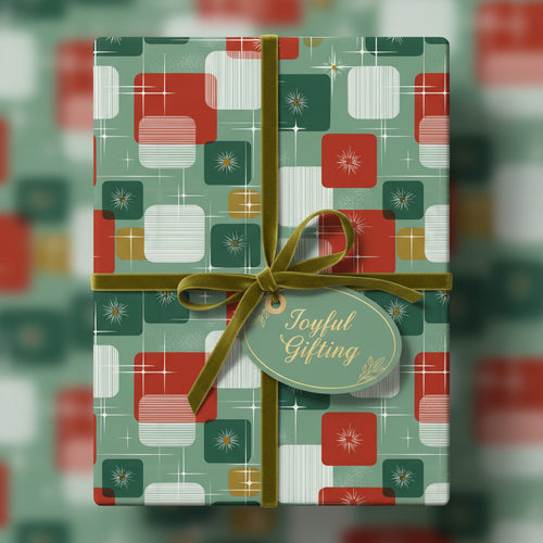 Retro Christmas gift wrap featuring a green velvet ribbon and "Joyful Gifting" tag.