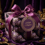 Elegant purple gift box wrapped in floral patterned wrapping paper with matching bow and tag.