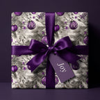 Elegant Christmas gift wrapped in purple ornament wrapping paper with a satin bow.