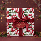 Elegant Christmas gift wrap with a red berry and leaf pattern, tied with a satin ribbon bow, and a "Happy Holidays" tag.