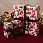 Elegant Christmas gift wrap with red velvet ribbon and a watercolor cherry berry design.