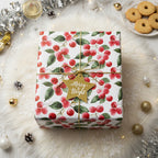 Christmas gift wrapped in floral wrapping paper, tied with gold ribbon and "Merry & Bright" star tag.