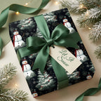Christmas gift wrapped in snowman print wrapping paper, tied with a green satin bow and "Let it Snow" tag.
