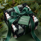 Christmas gift wrapped in snowman print paper with a green ribbon and "Season's Greetings" tag.