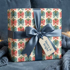 Vintage Christmas wrapping paper with a red and blue bow pattern and satin ribbon by Wrapped Studios.