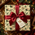 Vintage-style Christmas gift wrap with a holly and berry pattern, tied with a red satin ribbon.