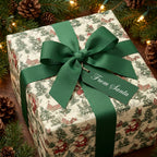 Vintage-style Christmas wrapping paper with green ribbon and "From Santa" tag. Wrapped Studios.
