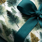 Watercolor forest wrapping paper with a teal ribbon. Wrapped Studios.