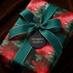 Elegant Christmas gift wrap by Wrapped Studios with green ribbon and watercolor tree pattern.