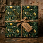 Luxury vintage botanical Christmas wrapping paper with a rustic twine bow by Wrapped Studios.