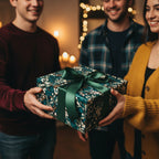People exchanging a gift wrapped in elegant floral wrapping paper with a dark green ribbon.