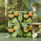 Citrus fruit wrapping paper with sheer green ribbon, ideal for a summer birthday gift.