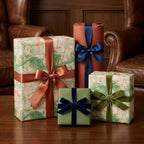 Vintage map wrapping paper and luxury gift wrap tied with velvet ribbons by Wrapped Studios.