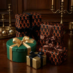 Vintage violin wrapping paper on luxury gift boxes with satin bows by Wrapped Studios.