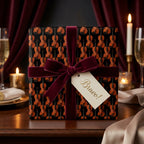 Violin wrapping paper with a burgundy velvet bow and Bravo gift tag by Wrapped Studios.