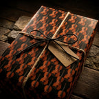 Vintage violin music wrapping paper on a rustic gift box with a twine bow by Wrapped Studios.
