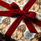 Vintage cocker spaniel dog Christmas wrapping paper with a red velvet bow by Wrapped Studios.