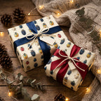 Gifts wrapped in beetle-print wrapping paper with ribbons on a rustic wooden surface.