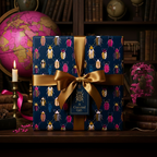 Elegant gift wrapped in navy blue beetle print wrapping paper, tied with a gold satin ribbon.