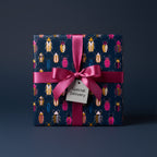 Chic gift wrapped in colorful beetle print wrapping paper with pink ribbon & "Special Delivery" tag.