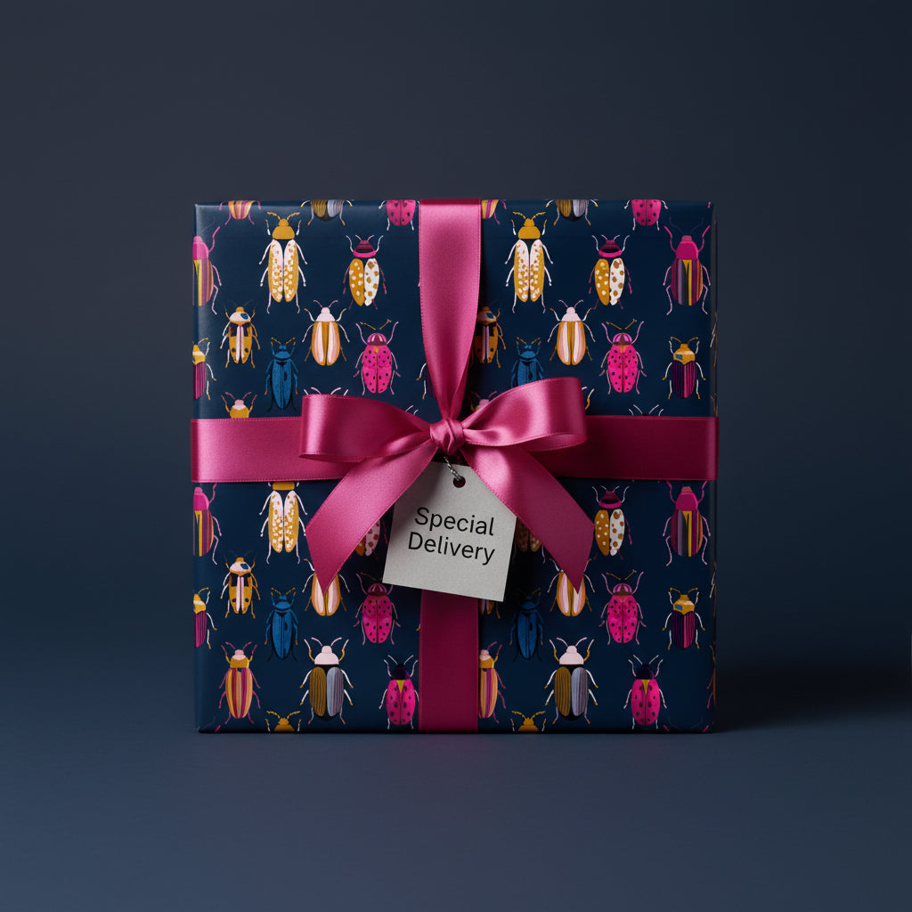Chic gift wrapped in colorful beetle print wrapping paper with pink ribbon & "Special Delivery" tag.
