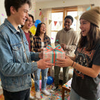Congratulations wrapping paper on a gift shared by friends at a party by Wrapped Studios.